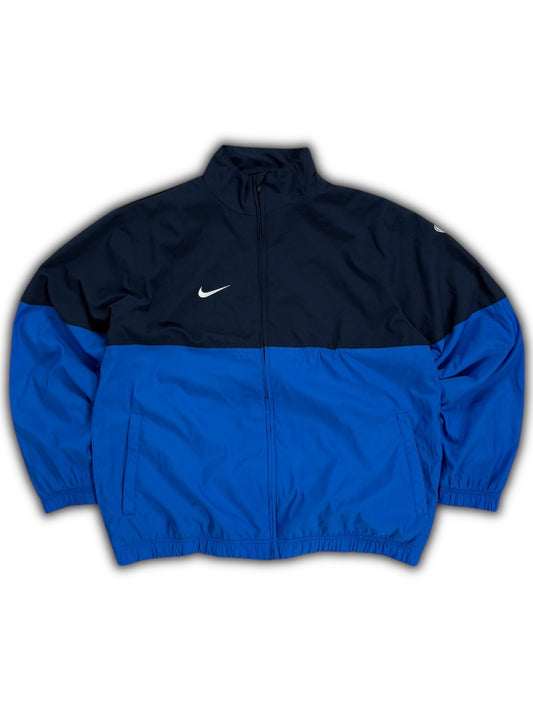 Cortavientos Nike vintage azul marino y blanco con cremallera de los años 00